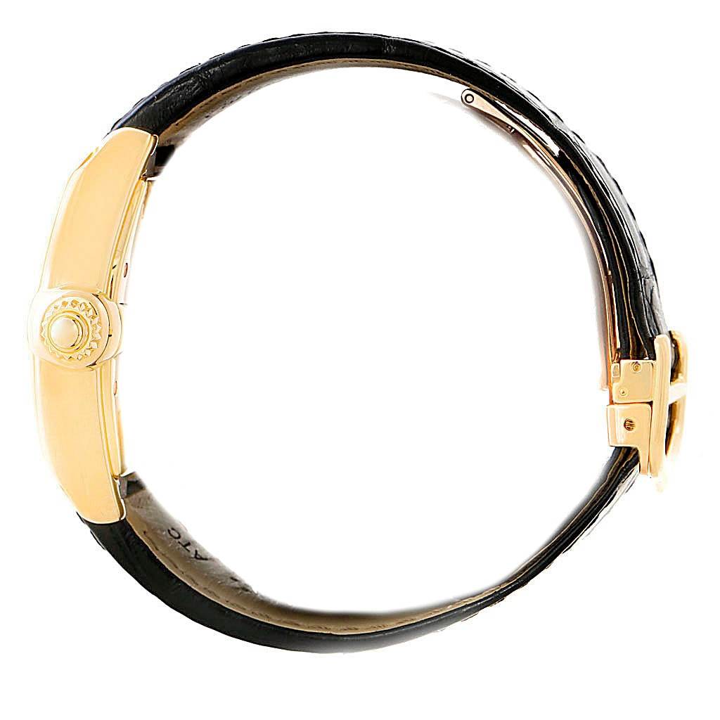 This image shows a side view of a Cartier Roadster W62005V2 Men's Yellow Gold Silver Dial W62005V2 Men's Yellow Gold Silver Dial watch, highlighting its crown, clasp, and strap.