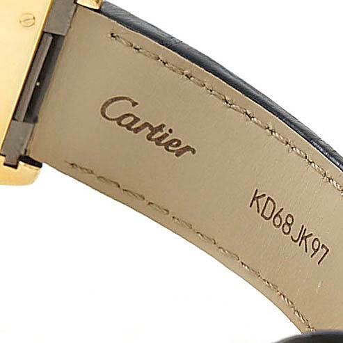 The image shows the inner leather strap of a Cartier Roadster W62005V2 Men's Yellow Gold Silver Dial W62005V2 Men's Yellow Gold Silver Dial watch, featuring the brand logo and serial number KD68JK97.