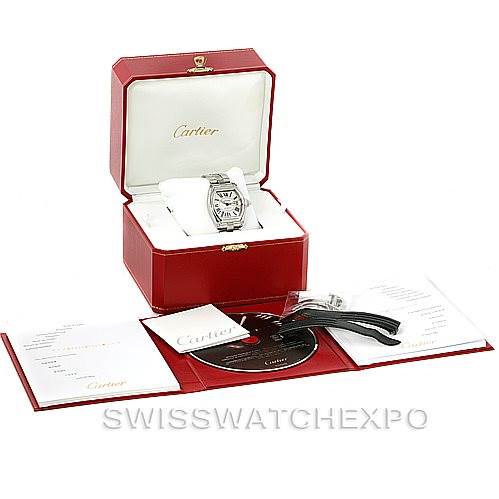 The image shows a Cartier Roadster W62025V3 Men's Stainless Steel Silver Dial W62025V3 Men's Stainless Steel Silver Dial watch with its original red box, paperwork, CD, and additional black wristbands.