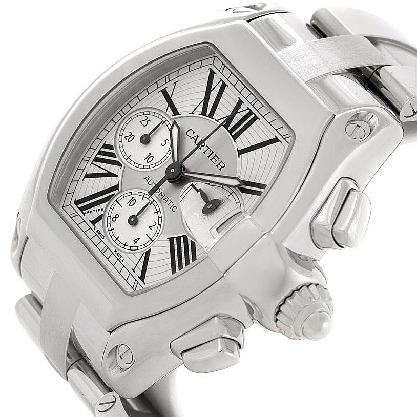 The image shows a close-up angle of a Cartier Roadster W62019X6 Men
s Stainless Steel Silver Dial W62019X6 Men
s Stainless Steel Silver Dial watch, highlighting its dial, crown, and part of the bracelet.