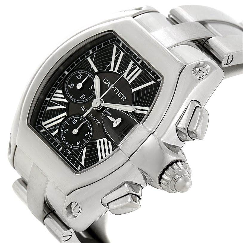 The image shows a partial side and front view of a Cartier Roadster W62020X6 Men's Stainless Steel Black Dial W62020X6 Men's Stainless Steel Black Dial watch, highlighting the case, bezel, dial, crown, and bracelet.