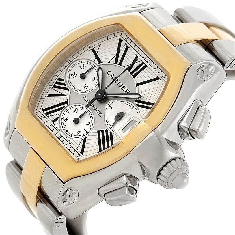 The Cartier Roadster W62027Z1 Men's Steel and Gold (two tone) Silver Dial W62027Z1 Men's Steel and Gold (two tone) Silver Dial watch is shown at an angled close-up, highlighting the dial, bezel, pushers, and crown with part of the bracelet.