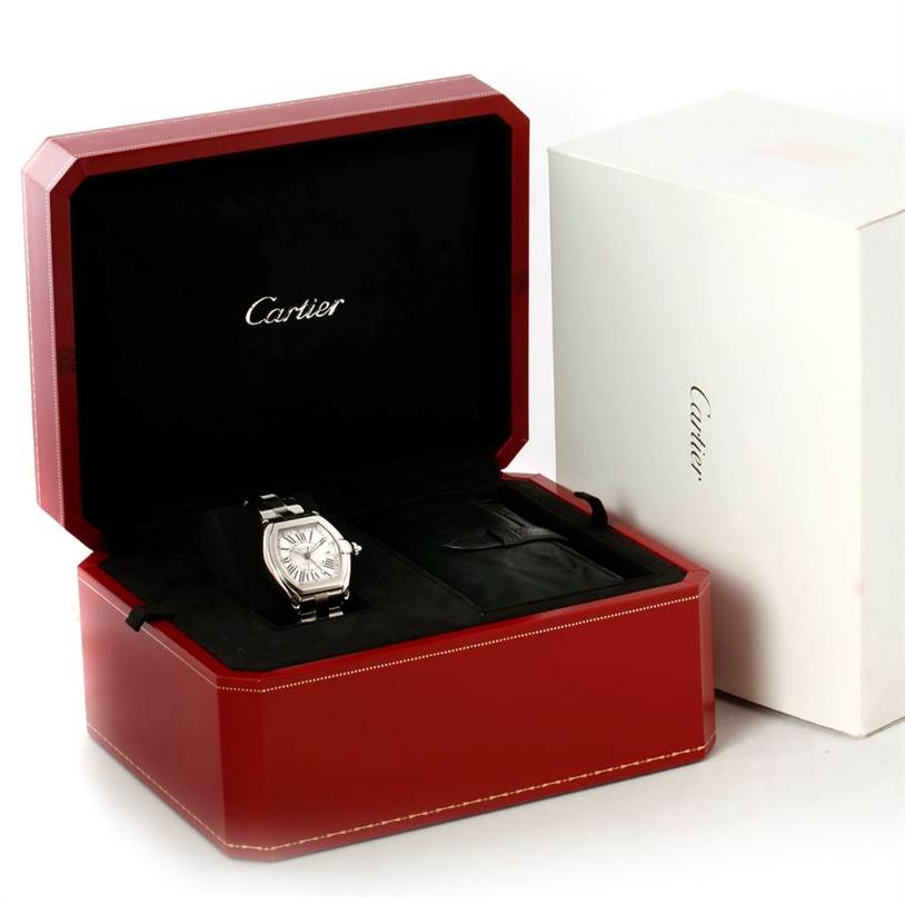 The Cartier Roadster W62032X6 Men's Stainless Steel Silver Dial W62032X6 Men's Stainless Steel Silver Dial watch is displayed in its open red box, with an additional white exterior box beside it.