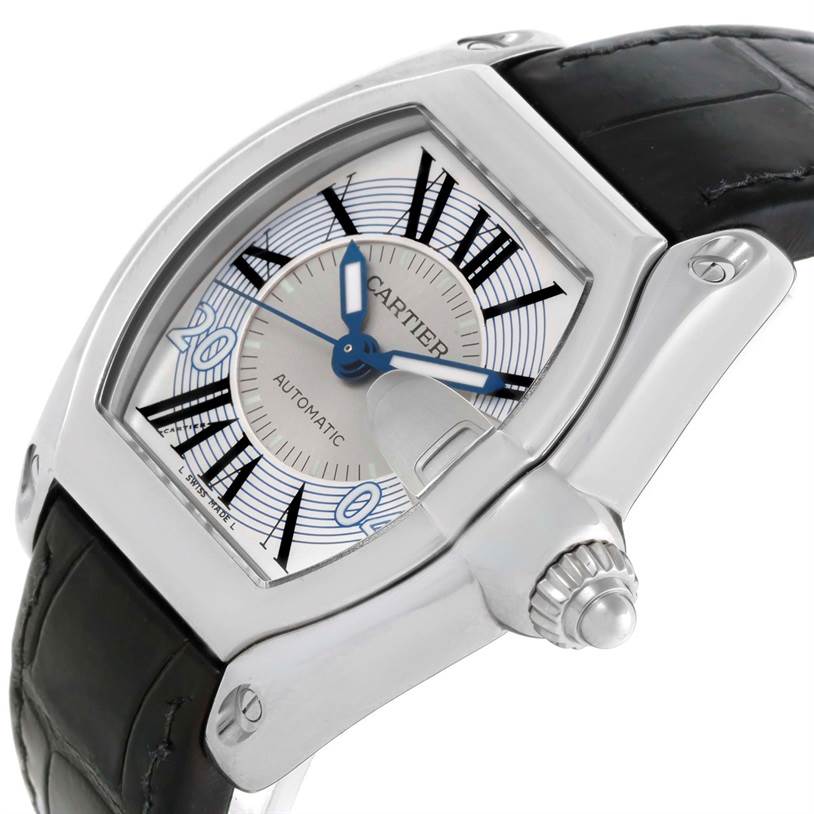 The Cartier Roadster W62025V3 Men's Stainless Steel Silver Dial W62025V3 Men's Stainless Steel Silver Dial watch is shown from an angled close-up, highlighting the face, crown, and part of the leather strap.