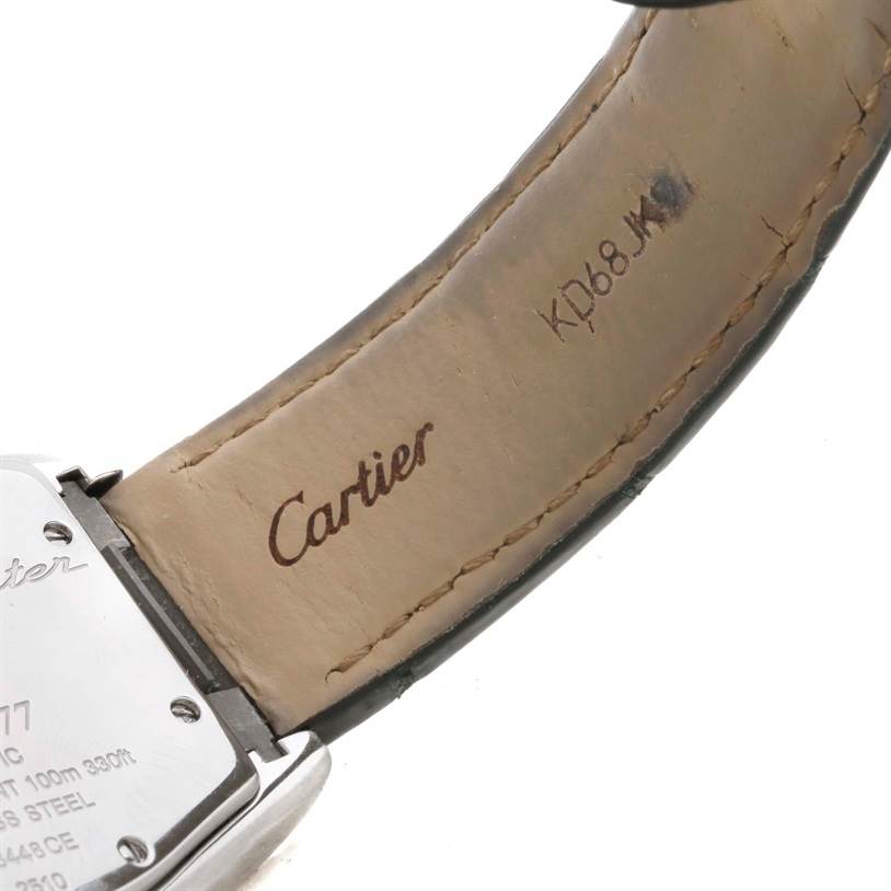 The image shows the back case and branded leather strap of the Roadster model by Cartier.