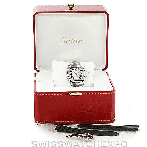 The image shows a Cartier Roadster W62025V3 Men's Stainless Steel Silver Dial W62025V3 Men's Stainless Steel Silver Dial watch in its open box, including extra straps and a tool.