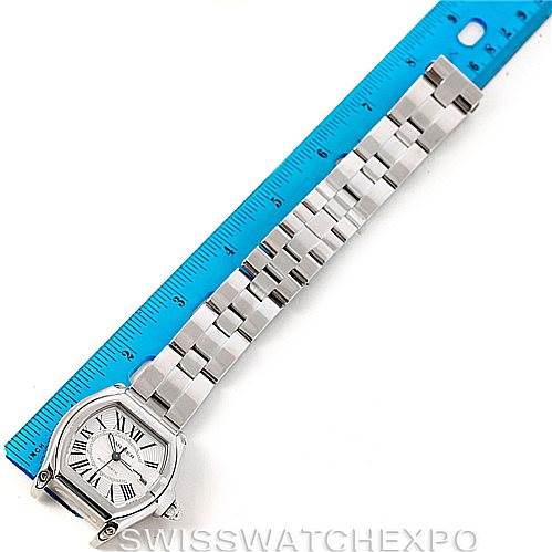 The image shows the Cartier Roadster W62025V3 Men's Stainless Steel Silver Dial W62025V3 Men's Stainless Steel Silver Dial watch from a top view, displaying the dial, case, and metal bracelet alongside a ruler.