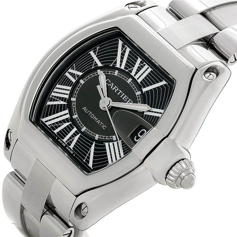 The image shows a close-up of the Cartier Roadster W62041V3 Men's Stainless Steel Black Dial W62041V3 Men's Stainless Steel Black Dial watch, highlighting the dial, crown, and part of the bracelet.