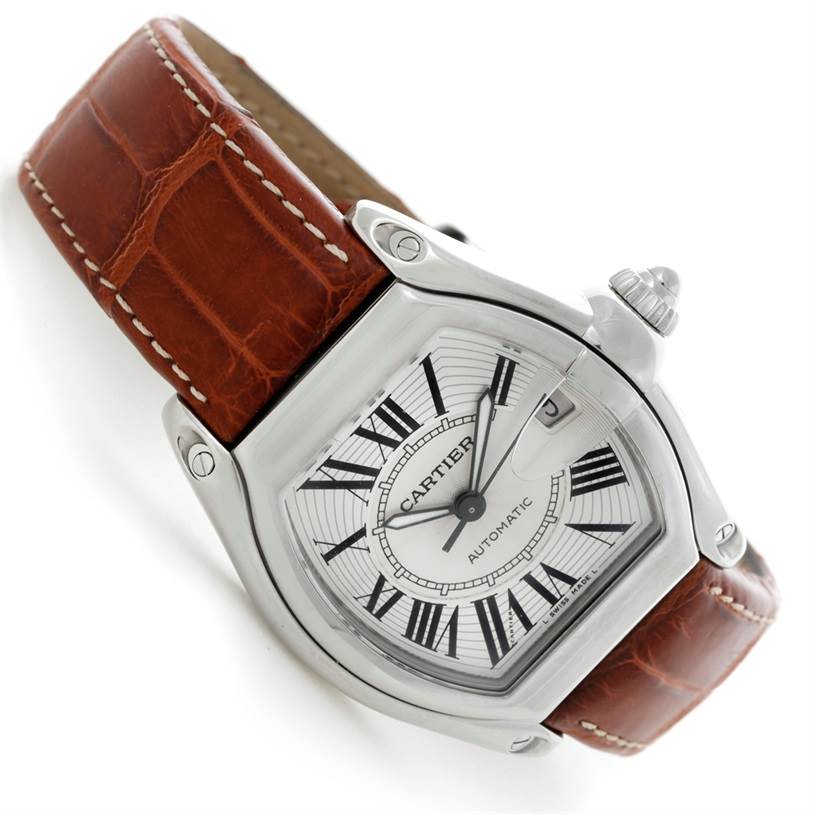 The Cartier Roadster W62025V3 Men
s Stainless Steel Silver Dial W62025V3 Men
s Stainless Steel Silver Dial watch is shown at an angle with its dial, brown leather strap, and crown visible.