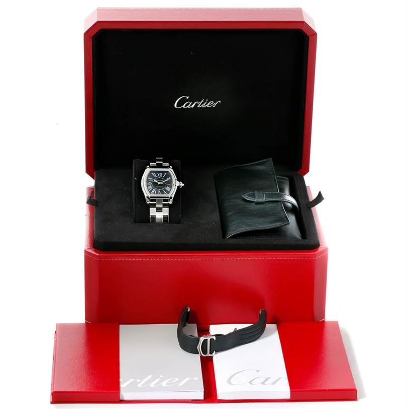 The Roadster model by Cartier is displayed in a red box, with an extra strap and booklet shown.