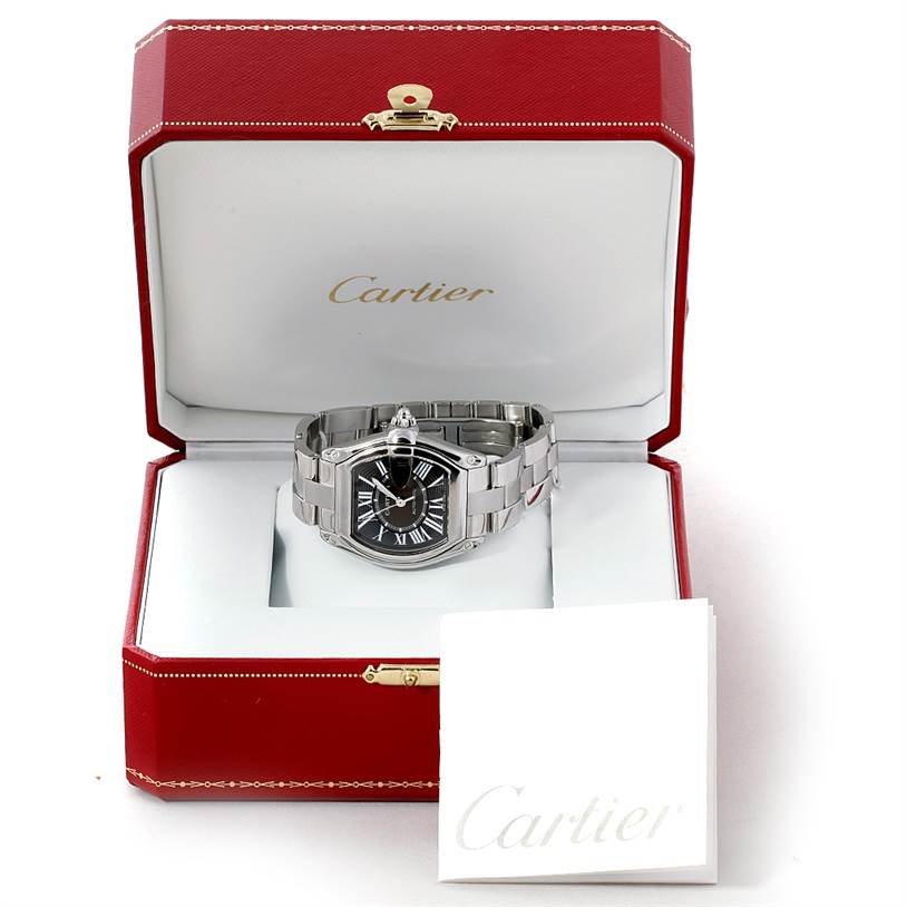 The Cartier Roadster W62041V3 Men's Stainless Steel Black Dial W62041V3 Men's Stainless Steel Black Dial watch is shown placed in an open red Cartier box with a white booklet in front.