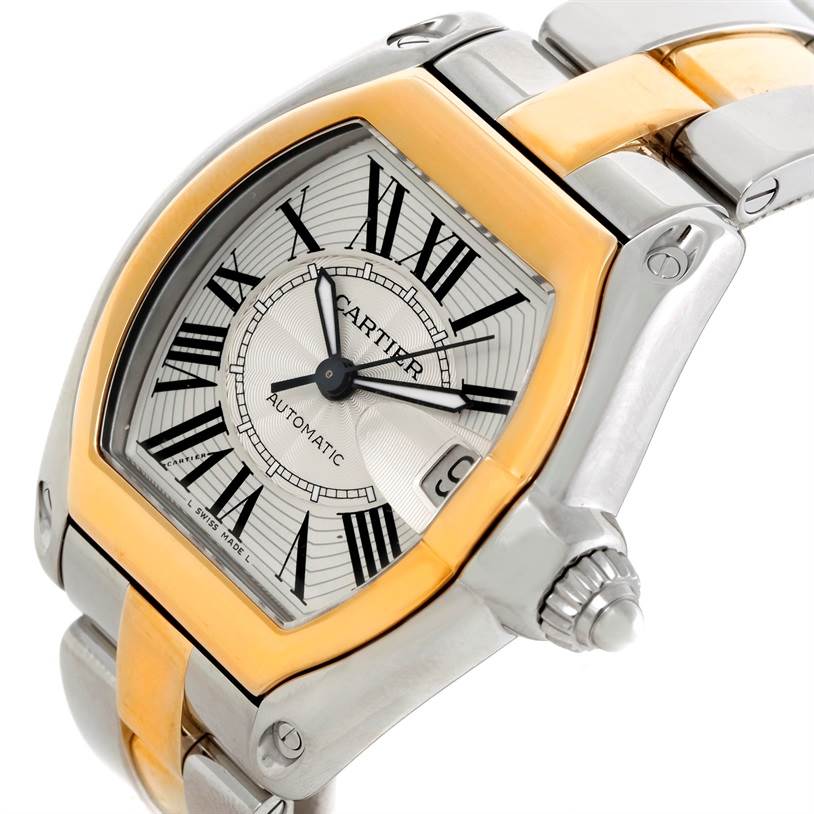 This image showcases a Cartier Roadster W62031Y4 Men's Steel and Gold (two tone) Silver Dial W62031Y4 Men's Steel and Gold (two tone) Silver Dial watch from an angled close-up, highlighting the face, bezel, and part of the bracelet.