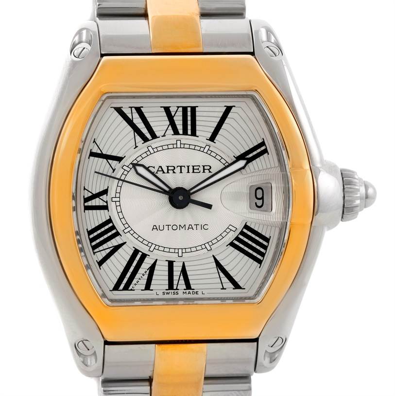 The image shows a frontal view of the Cartier Roadster W62031Y4 Men's Steel and Gold (two tone) Silver Dial W62031Y4 Men's Steel and Gold (two tone) Silver Dial watch, highlighting its face, Roman numeral markers, and part of the bracelet.