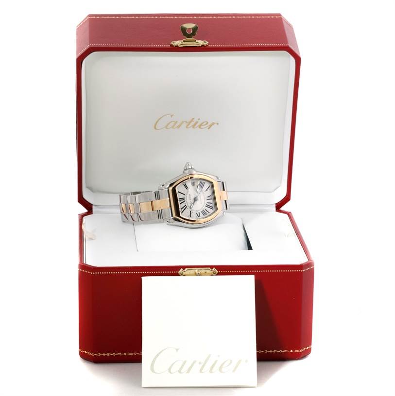 The image shows a Cartier Roadster W62031Y4 Men's Steel and Gold (two tone) Silver Dial W62031Y4 Men's Steel and Gold (two tone) Silver Dial watch with a two-tone bracelet, displayed inside its red Cartier box.
