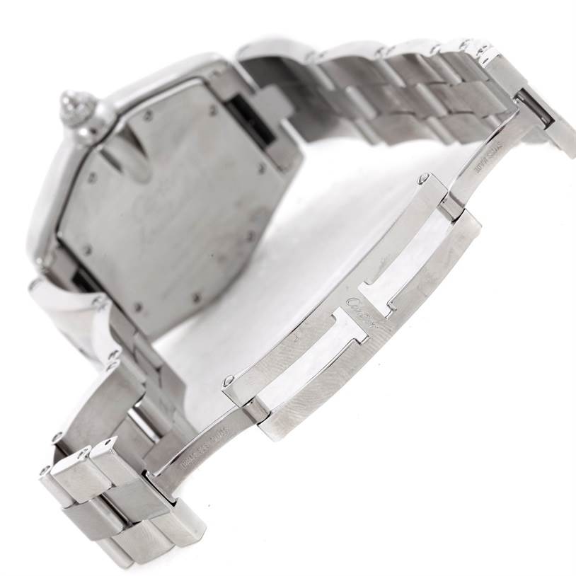 This image shows the back of a Cartier Roadster W62041V3 Men's Stainless Steel Black Dial W62041V3 Men's Stainless Steel Black Dial watch and its partially open stainless steel bracelet clasp.