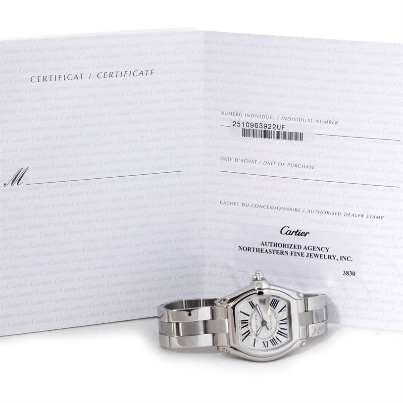 The image shows a Cartier Roadster W62025V3 Men's Stainless Steel Silver Dial W62025V3 Men's Stainless Steel Silver Dial watch with its certification, viewed from the front.