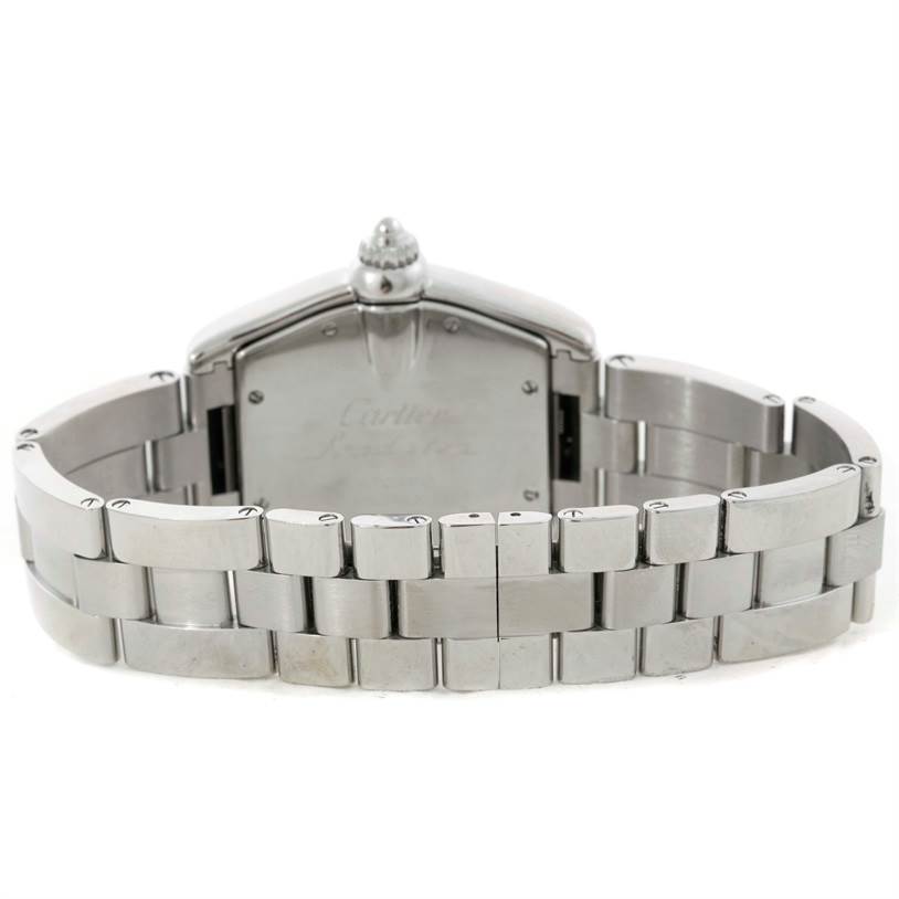 This image shows the back of the Roadster model by Cartier, focusing on the case back and metal bracelet.