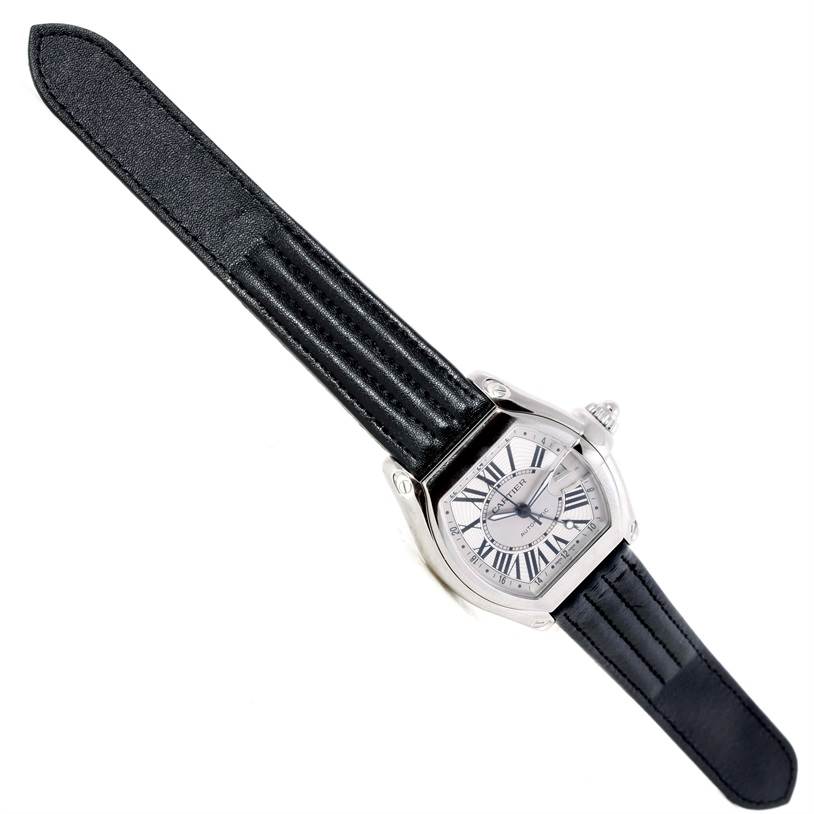 The image shows a top view of a Cartier Roadster W62032X6 Men's Stainless Steel Silver Dial W62032X6 Men's Stainless Steel Silver Dial watch, highlighting the black leather strap and the rectangular dial with Roman numerals.