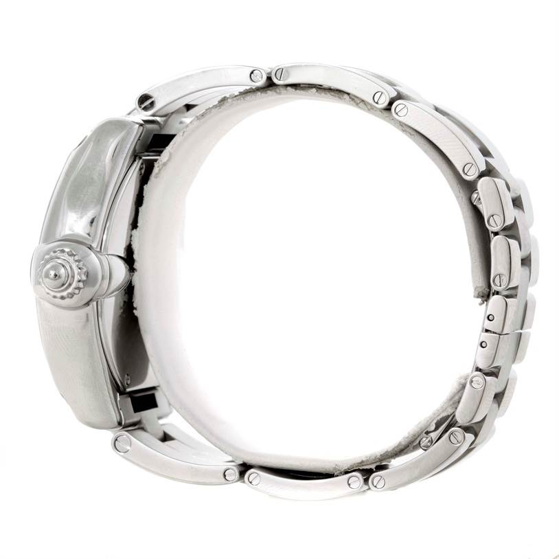 The image shows a side view of the Cartier Roadster W62032X6 Men's Stainless Steel Silver Dial W62032X6 Men's Stainless Steel Silver Dial watch, focusing on the crown and bracelet.