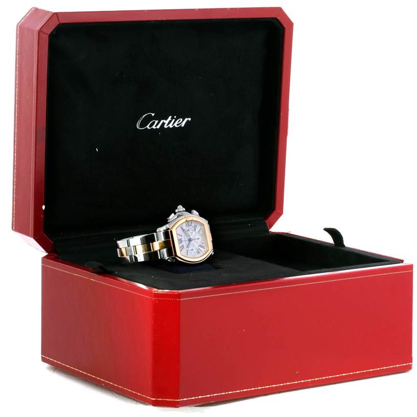 The Cartier Roadster W62027Z1 Men's Steel and Gold (two tone) Silver Dial W62027Z1 Men's Steel and Gold (two tone) Silver Dial watch is displayed in a partially open red box, showcasing its face and bracelet.