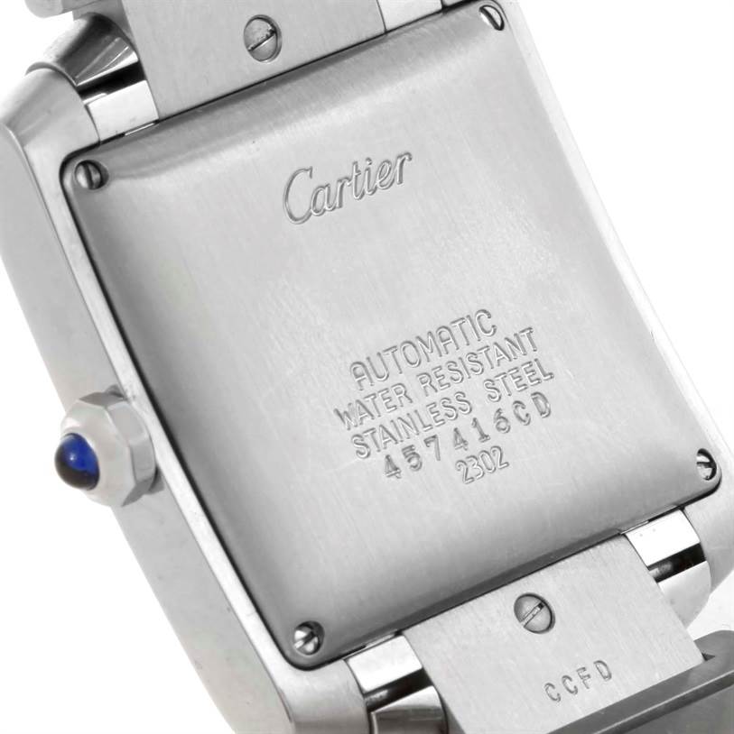 The image shows the back case and side crown of a Cartier Tank Francaise W51002Q3 Men's Stainless Steel Silver Dial W51002Q3 Men's Stainless Steel Silver Dial watch at an angle.