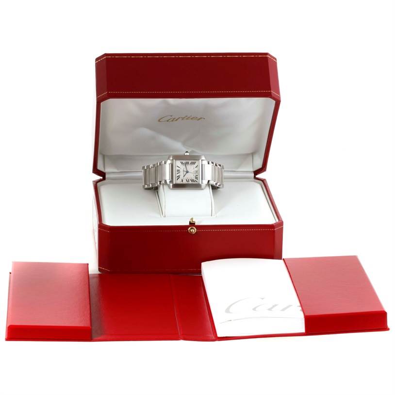 The Cartier Tank Francaise W51002Q3 Men's Stainless Steel Silver Dial W51002Q3 Men's Stainless Steel Silver Dial watch is shown in an open box with a red cover, alongside its manual and additional accessories.