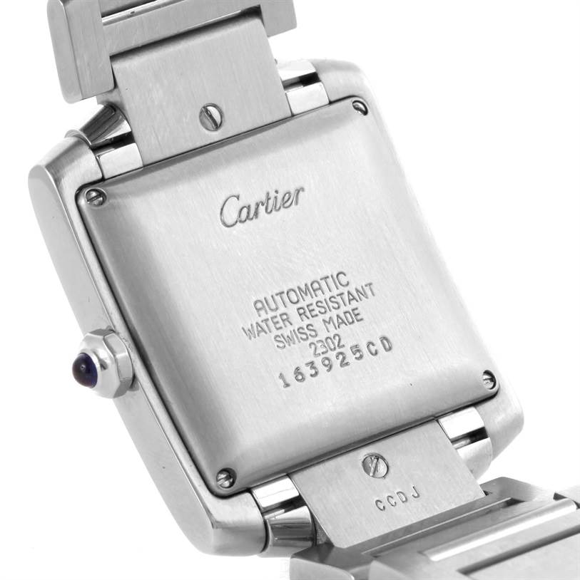 The image shows the back case of a Cartier Tank Francaise W51002Q3 Men's Stainless Steel Silver Dial W51002Q3 Men's Stainless Steel Silver Dial watch, highlighting its engravings and clasp.