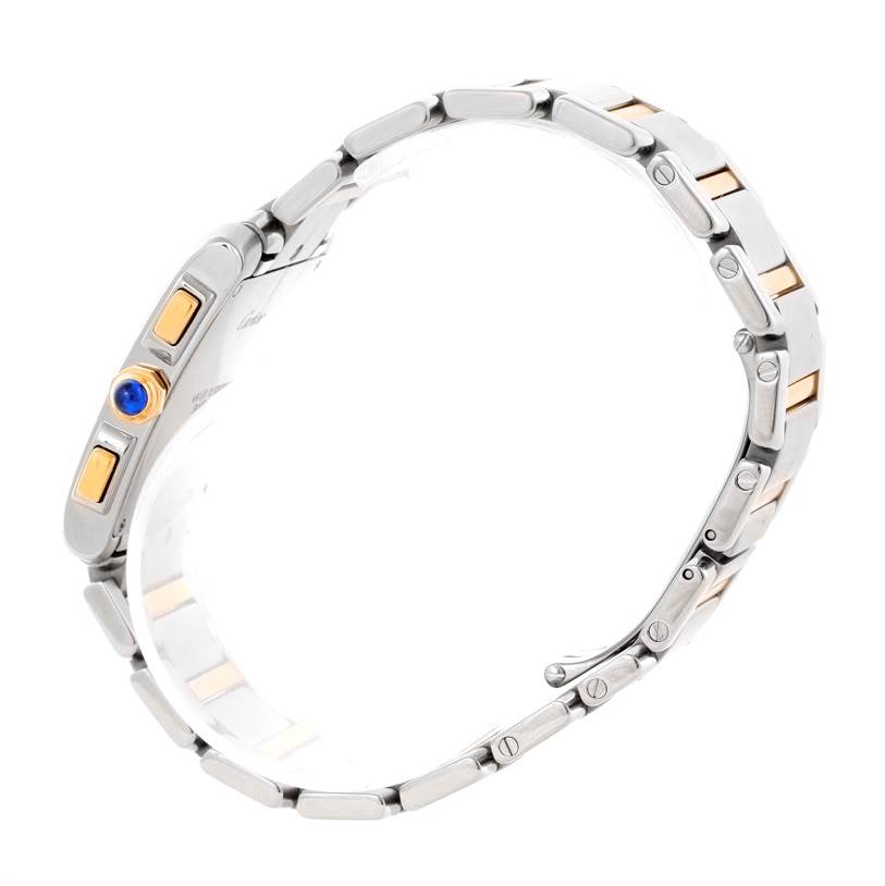 The image shows the side view of a Cartier Tank Française watch, highlighting the bracelet and crown with a blue cabochon.