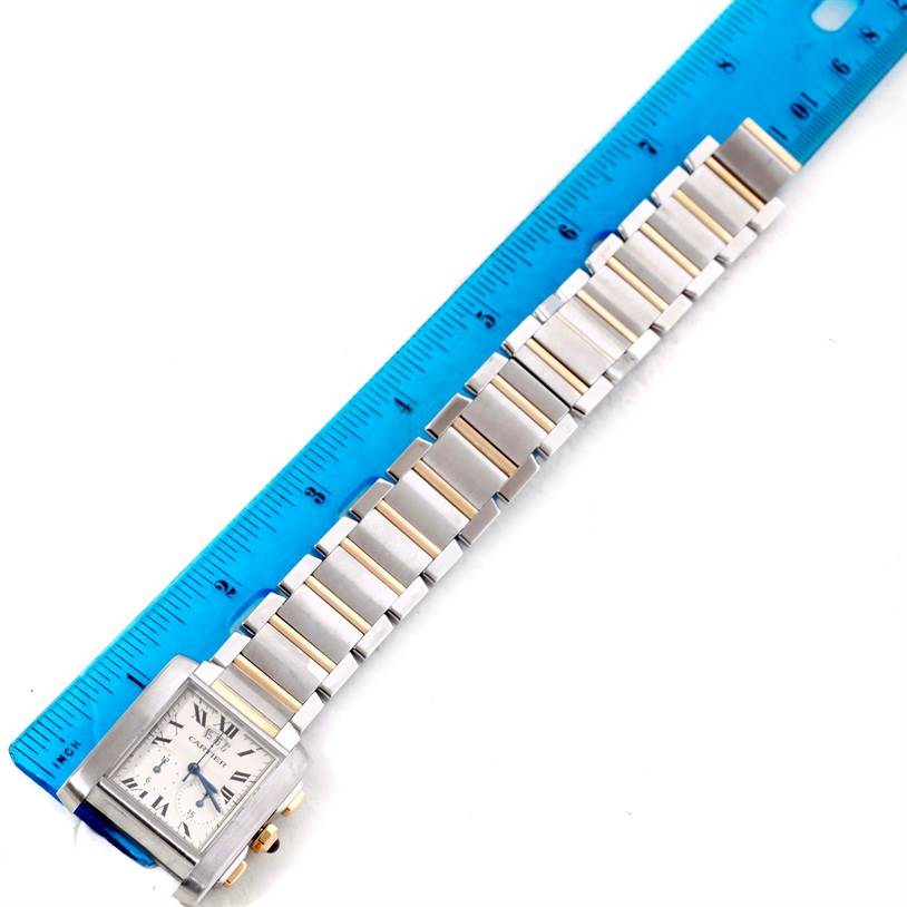 The Cartier Tank Francaise W51004Q4 Men
s Steel and Gold (two tone) Silver Dial W51004Q4 Men
s Steel and Gold (two tone) Silver Dial watch is shown flat, with the bracelet extended alongside a ruler for measurement.