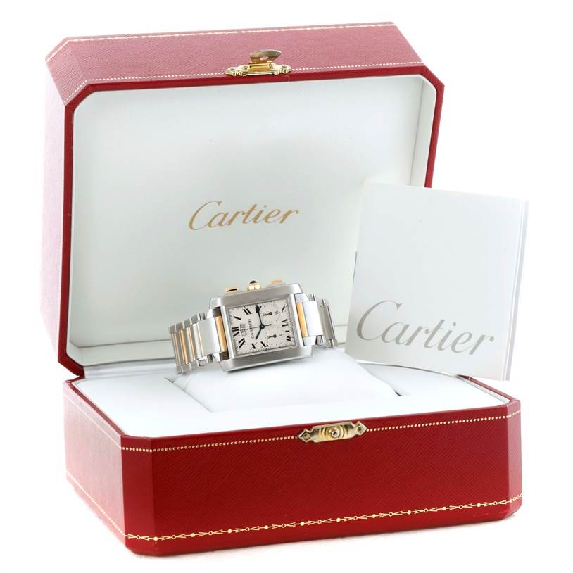 The Cartier Tank Francaise W51004Q4 Men
s Steel and Gold (two tone) Silver Dial W51004Q4 Men
s Steel and Gold (two tone) Silver Dial watch is shown from a front angle inside its open red box with a warranty booklet.