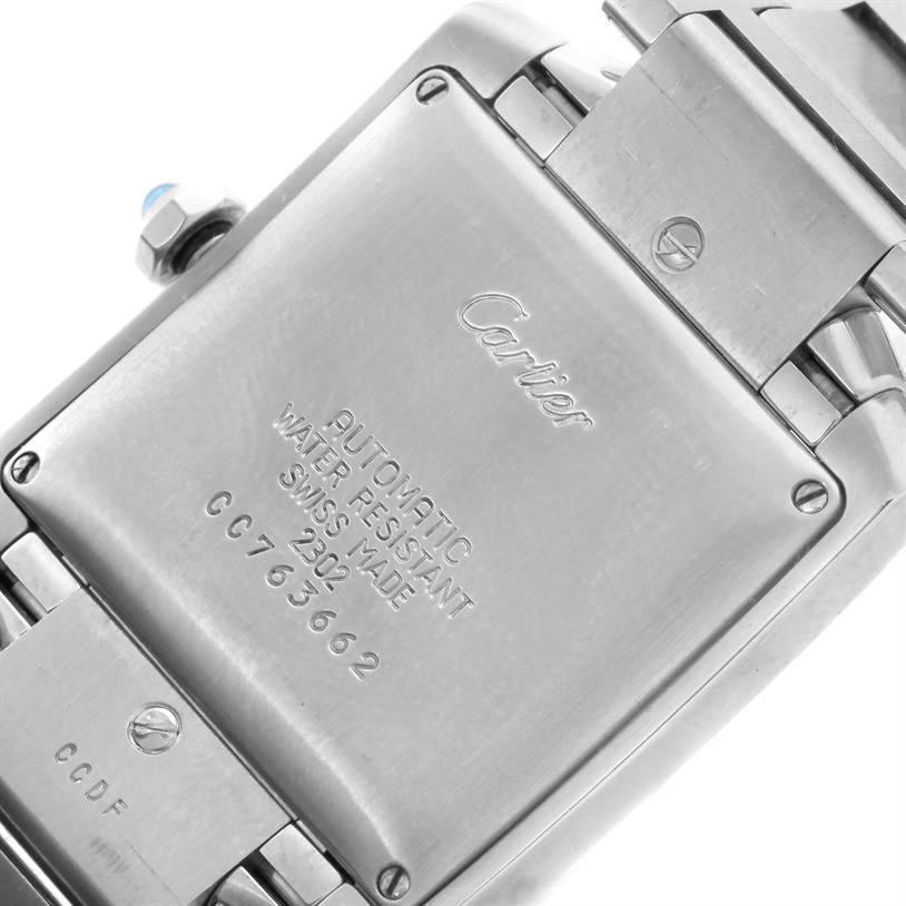 The image shows the back view of a Cartier Tank Française watch, highlighting its case back and part of the bracelet.