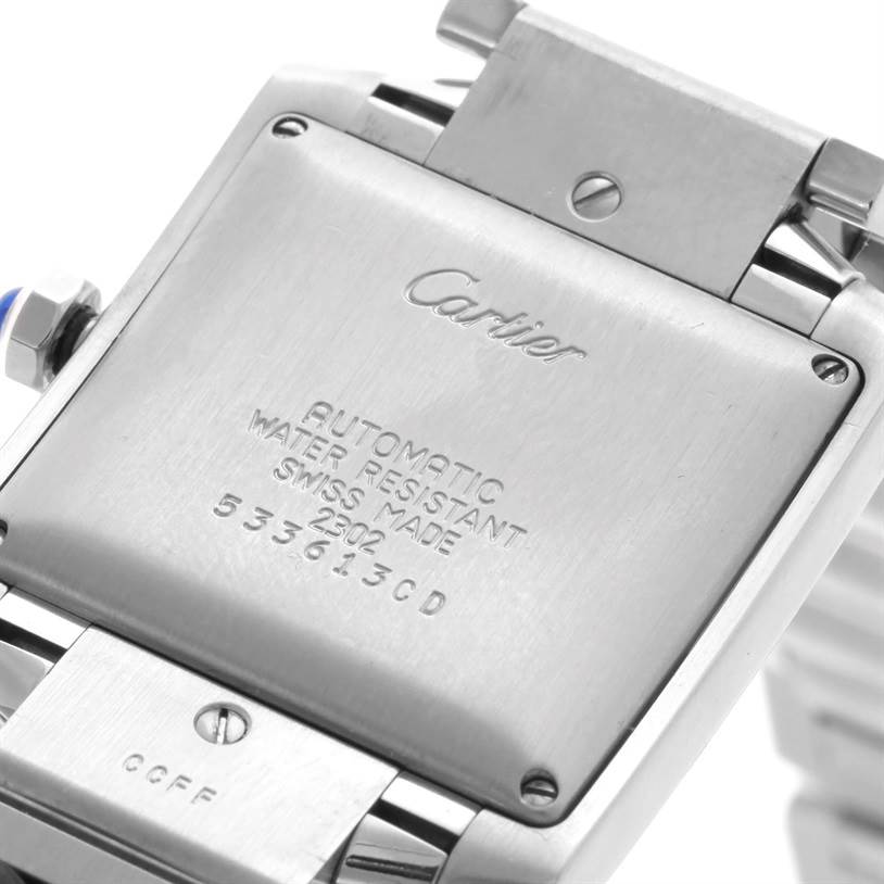 The image shows the back case of a Cartier Tank Française watch, highlighting its engravings and water resistance details.