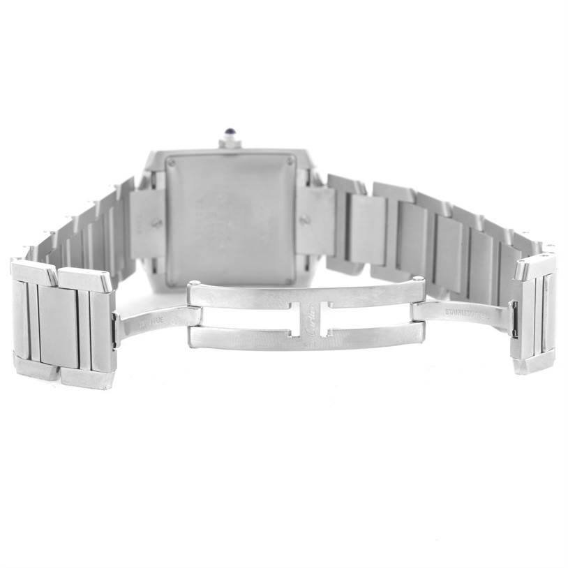 The image shows the back and bracelet clasp of a Cartier Tank Française watch.