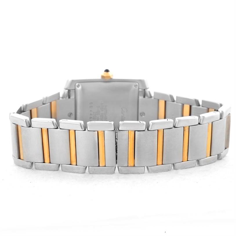 The image shows the back and the band of the Cartier Tank Francaise W51005Q4 Men
s Steel and Gold (two tone) Silver Dial W51005Q4 Men
s Steel and Gold (two tone) Silver Dial watch, highlighting the two-tone metal links.