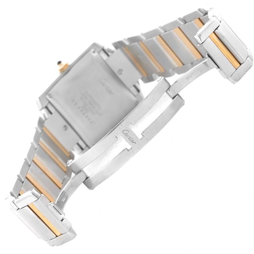 The image shows the back of a Cartier Tank Française watch, highlighting the bracelet and clasp.