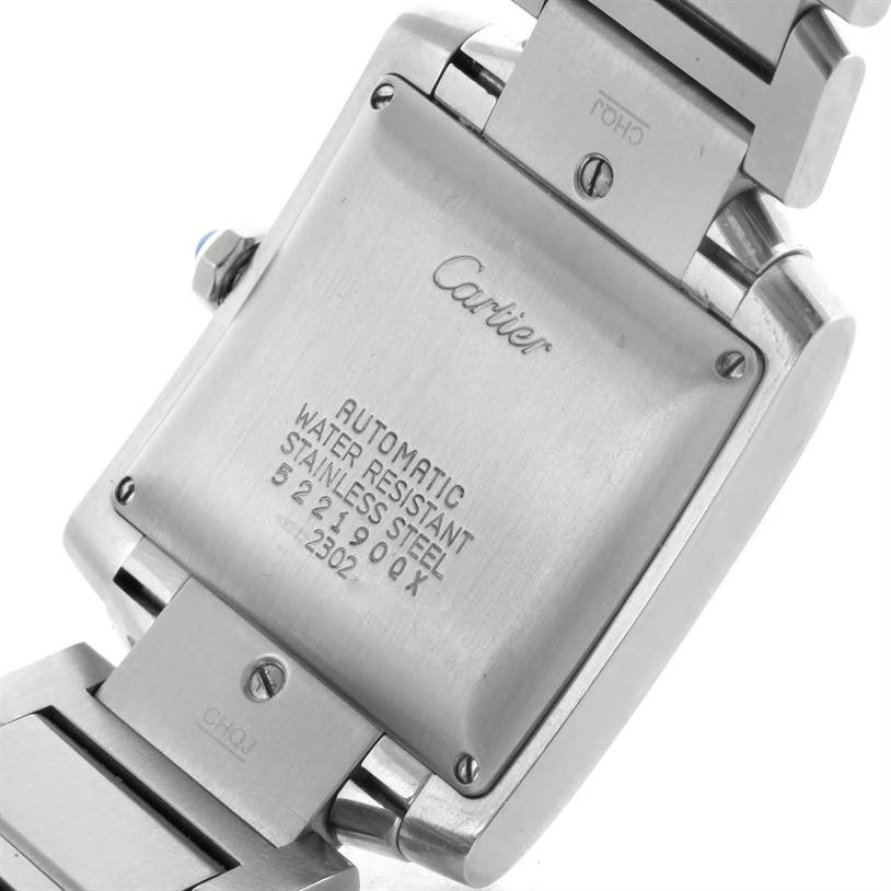 The image shows the back casing and part of the bracelet of a Cartier Tank Française watch.