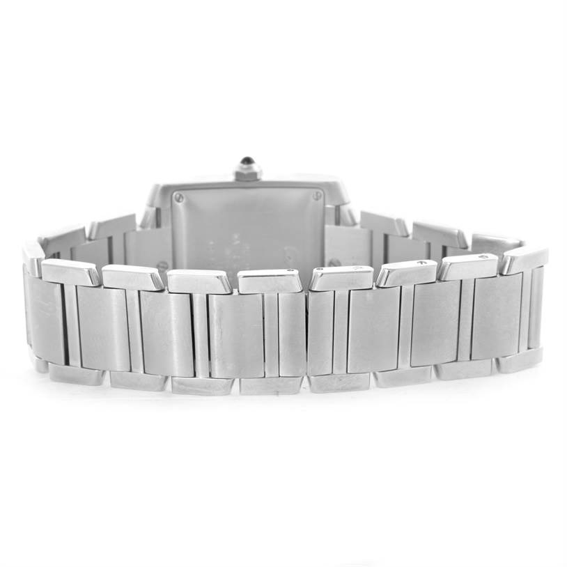 The image shows the back view of the Cartier Tank Française watch, focusing on its stainless steel bracelet and case.