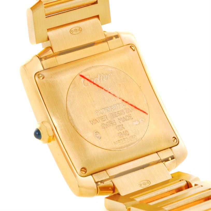 The image shows the back case and part of the bracelet for a Cartier Tank Francaise W50001R2 Men's Yellow Gold Silver Dial W50001R2 Men's Yellow Gold Silver Dial watch, highlighting the engravings and markings.