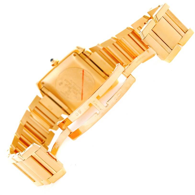 The image shows the back and open clasp of a Cartier Tank Française watch in a gold finish.