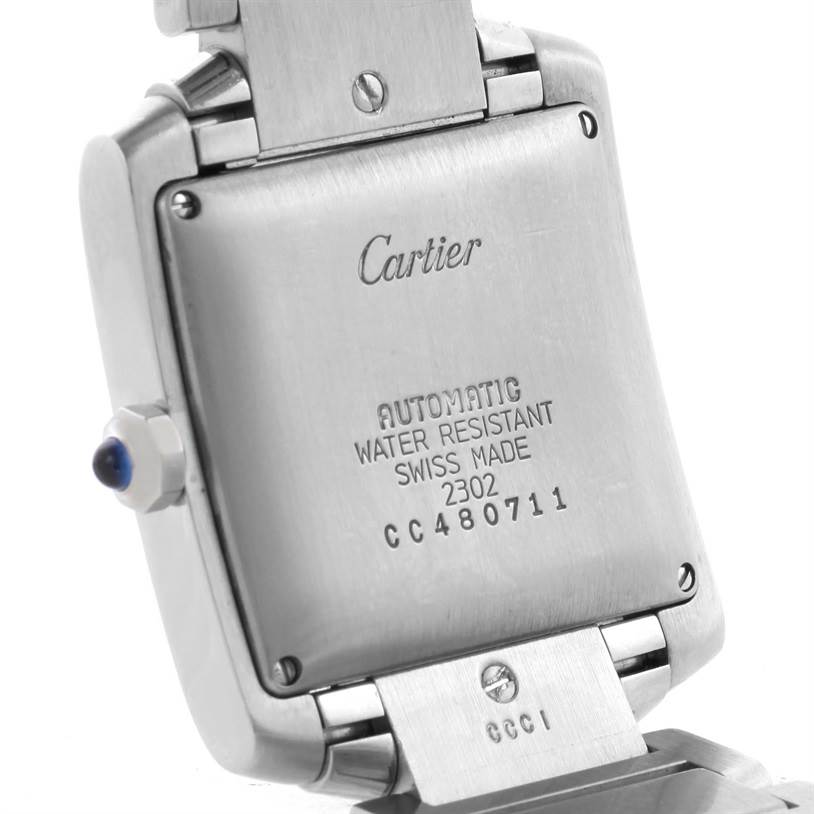 This image shows the backside of a Cartier Tank Française watch, highlighting its case, serial number, and part of the bracelet.