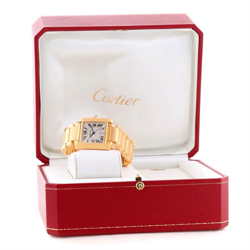 The Cartier Tank Francaise W50001R2 Men's Yellow Gold Silver Dial W50001R2 Men's Yellow Gold Silver Dial watch is shown from the front, inside a red and white Cartier box.