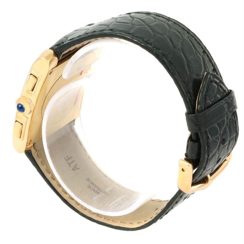 The image shows a side view of the Cartier Tank Francaise W5000556 Men
s Yellow Gold Silver Dial W5000556 Men
s Yellow Gold Silver Dial watch, highlighting its black leather strap and gold buckle.