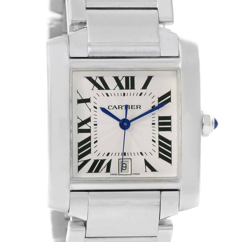 The image shows a close-up of the Cartier Tank Française watch face and part of the bracelet, focusing on the Roman numeral dial and blue hands.