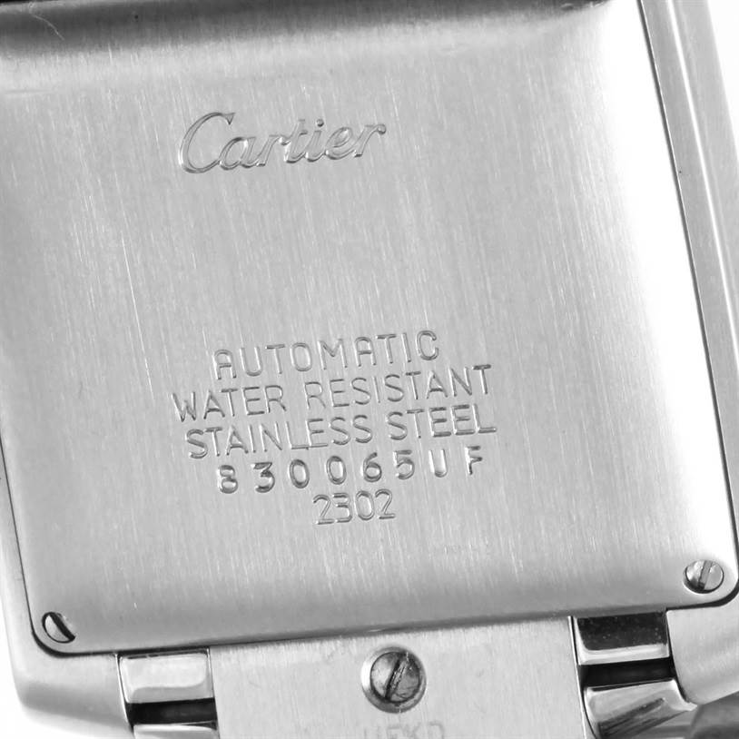 The image shows the back case of a Tank Francaise watch by Cartier, displaying its markings and specifications.