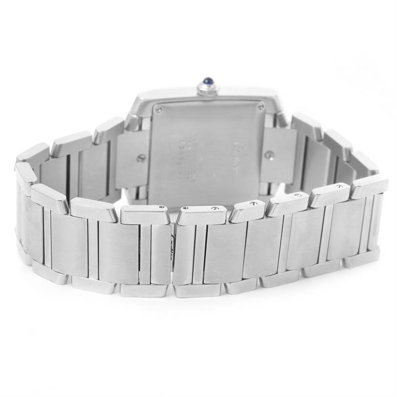 The image shows the back and bracelet of a Cartier Tank Francaise W51002Q3 Men
s Stainless Steel Silver Dial W51002Q3 Men
s Stainless Steel Silver Dial watch at an angle focused on the clasp and links.