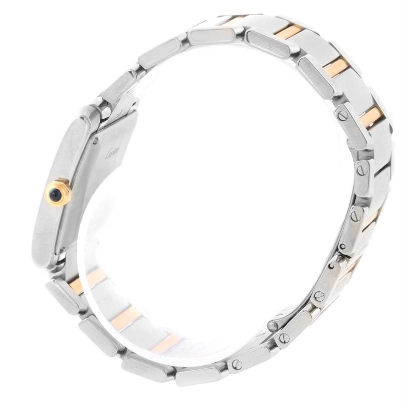 This image shows the side view of a Cartier Tank Francaise W51005Q4 Men
s Steel and Gold (two tone) Silver Dial W51005Q4 Men
s Steel and Gold (two tone) Silver Dial watch, highlighting its bracelet and crown.
