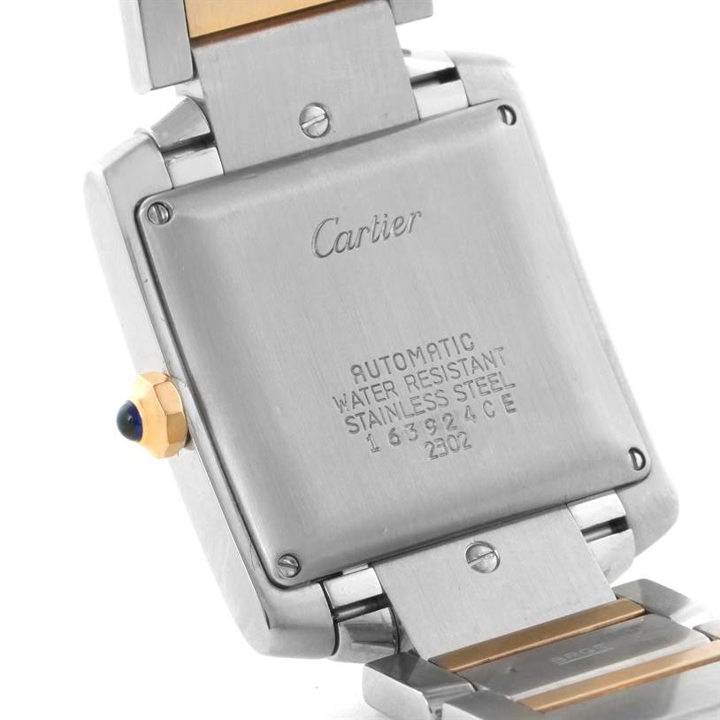 The image shows the back case, part of the bracelet, and crown of a Cartier Tank Francaise W51005Q4 Men
s Steel and Gold (two tone) Silver Dial W51005Q4 Men
s Steel and Gold (two tone) Silver Dial watch.