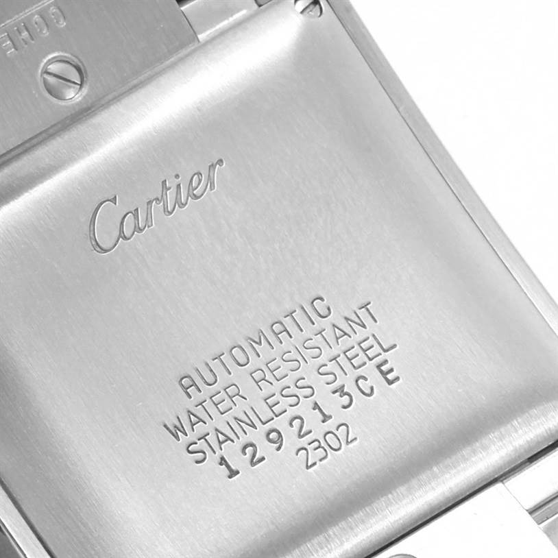 The image shows the back case of a Tank Francaise model by Cartier, highlighting its inscriptions and material.