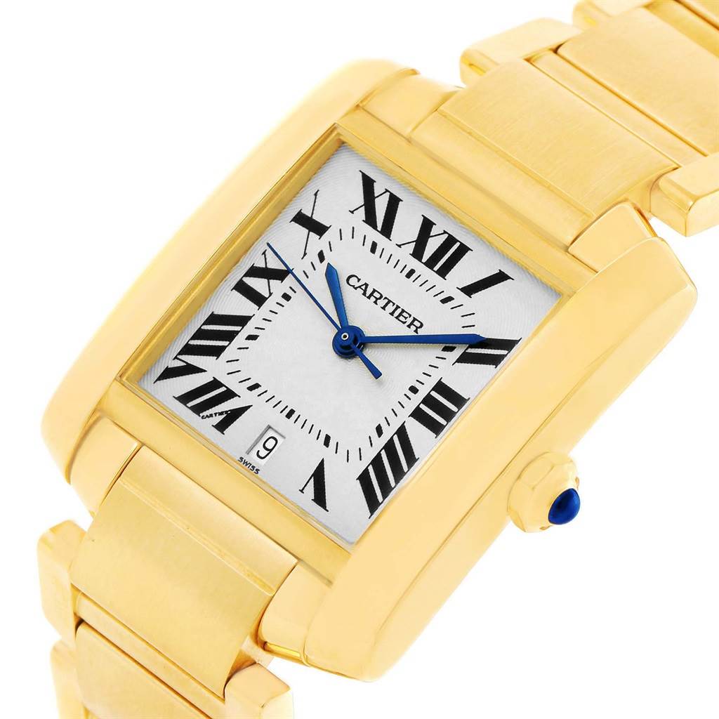 This image shows a close-up angle of the Cartier Tank Francaise W50001R2 Yellow Gold Silver Dial W50001R2 Yellow Gold Silver Dial watch, highlighting the dial, crown, and part of the bracelet.
