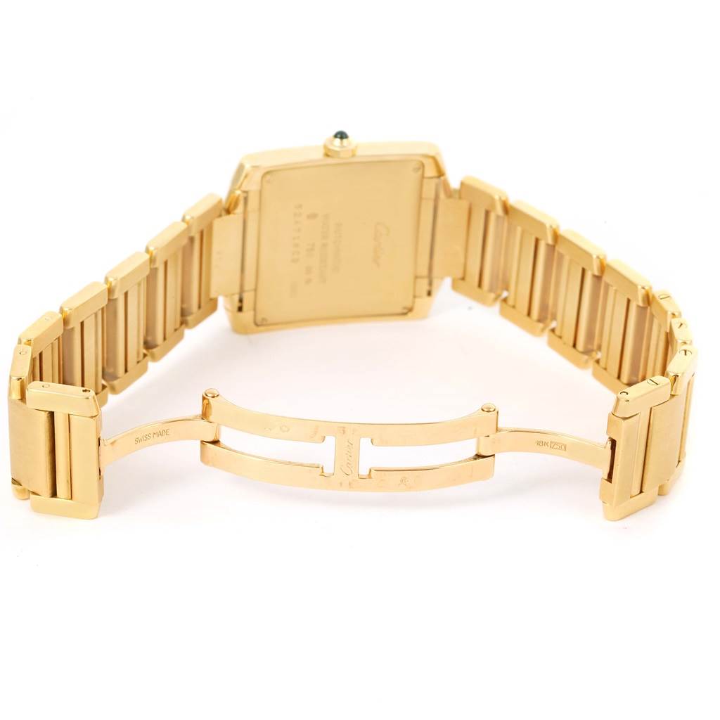 This image shows the back view and open clasp of the Cartier Tank Francaise W50001R2 Yellow Gold Silver Dial W50001R2 Yellow Gold Silver Dial watch, highlighting its bracelet and case back.